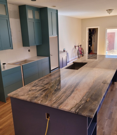 kitchen under renovation featuring a large island